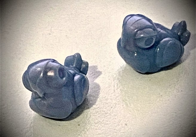 image of two plastic pigeon meeples from the tabletop game oh my pigeons