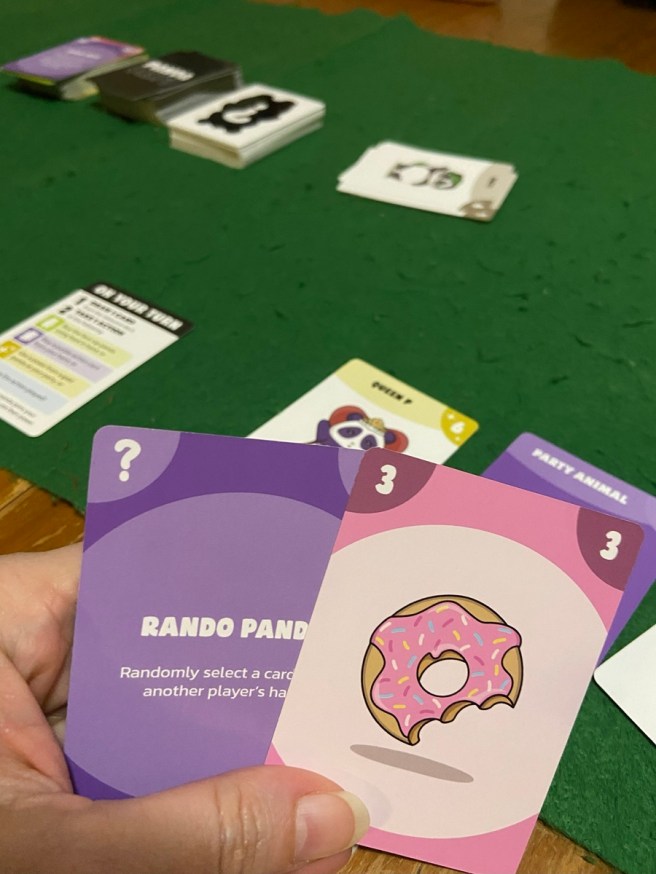 image of cards held in hand during a game of Panda Party