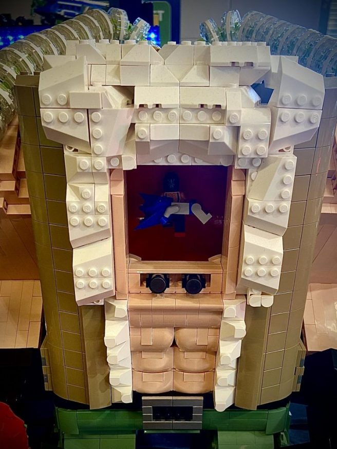Picture of LEGO MOC of Mega Bane with Batman Easter Egg scene inside showing Bane breaking Batman's back